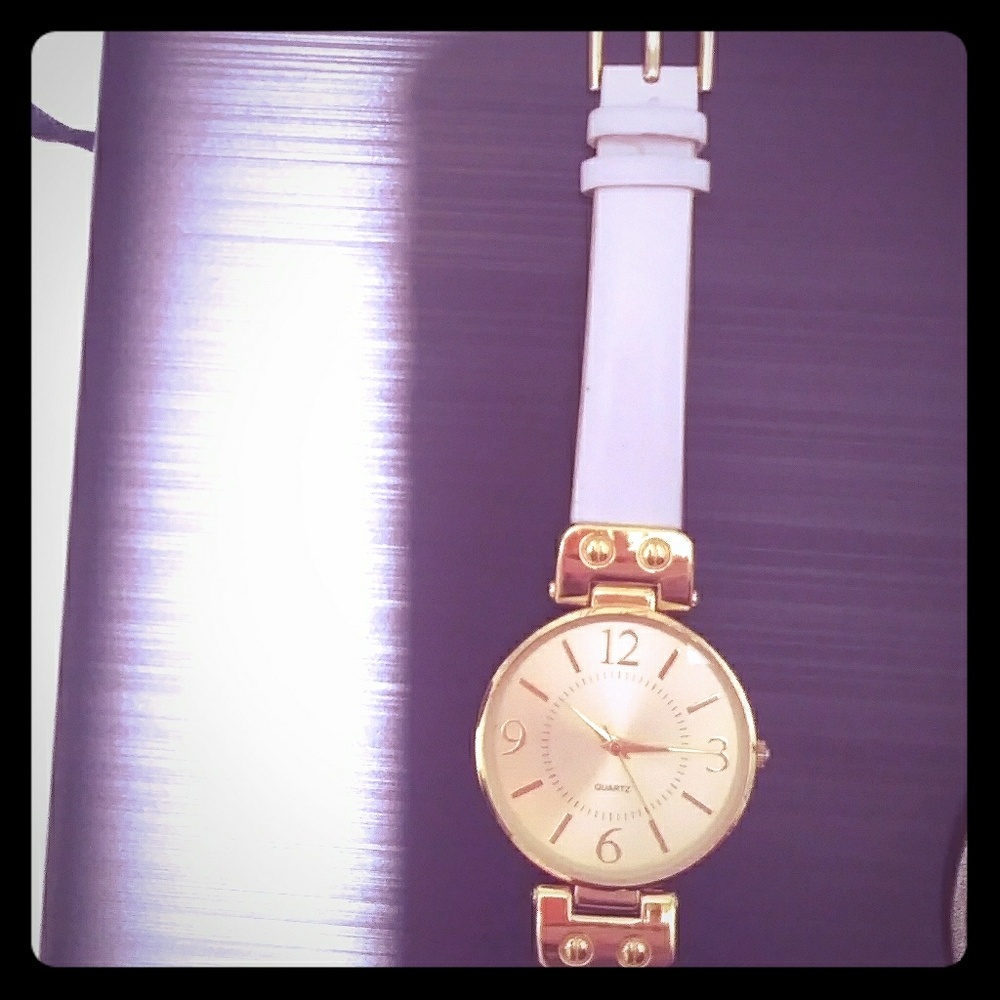 Gold-faced wristwatch with white band